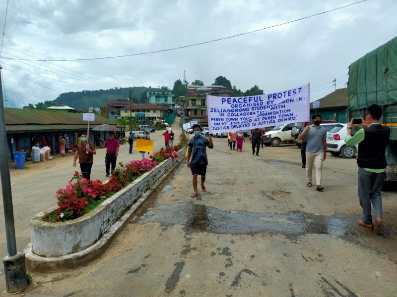 People holding banners during the peaceful protest rally in Peren town on June 10. (Morung Photo)